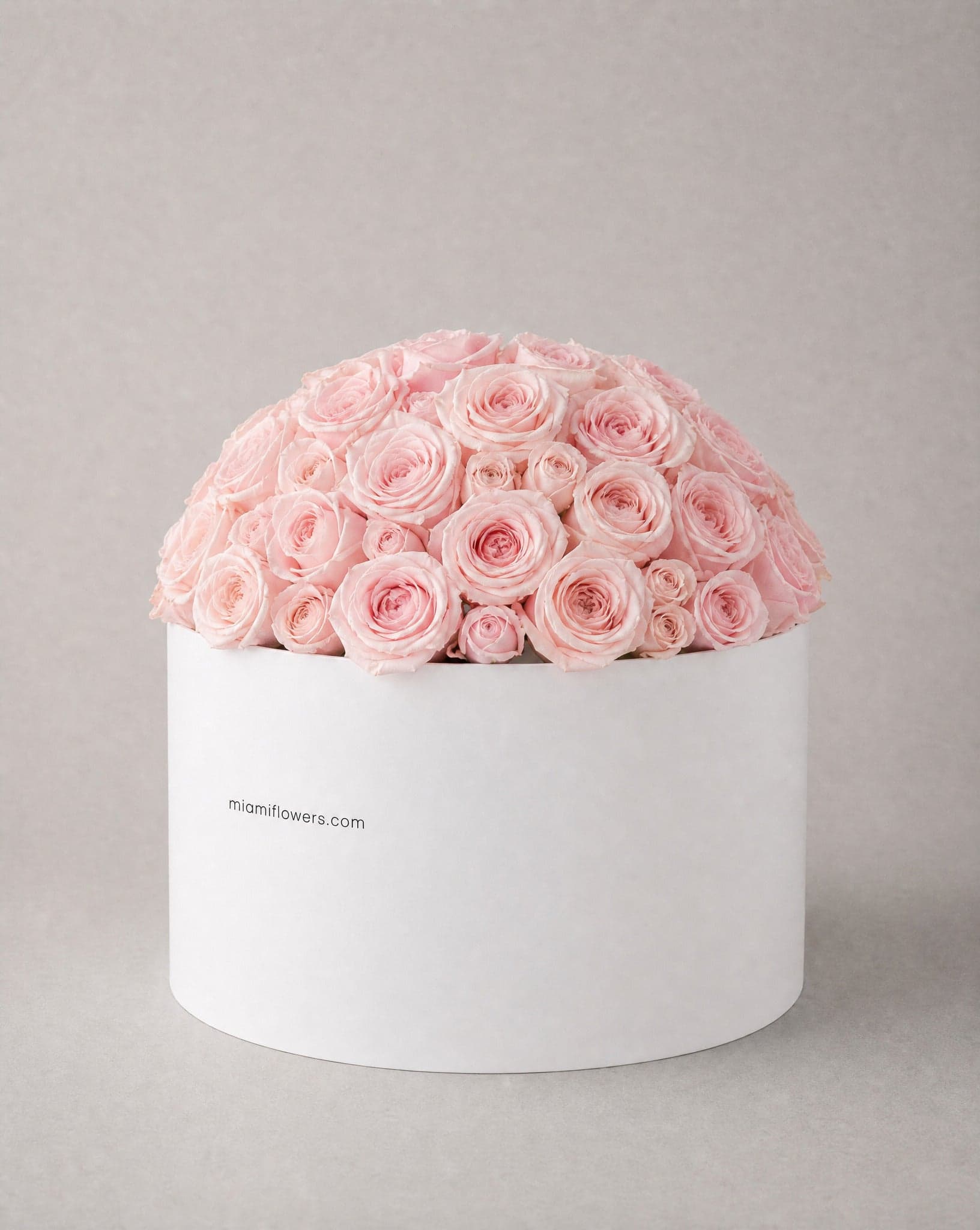 Roses in an oval box printed with miamiflowers.com