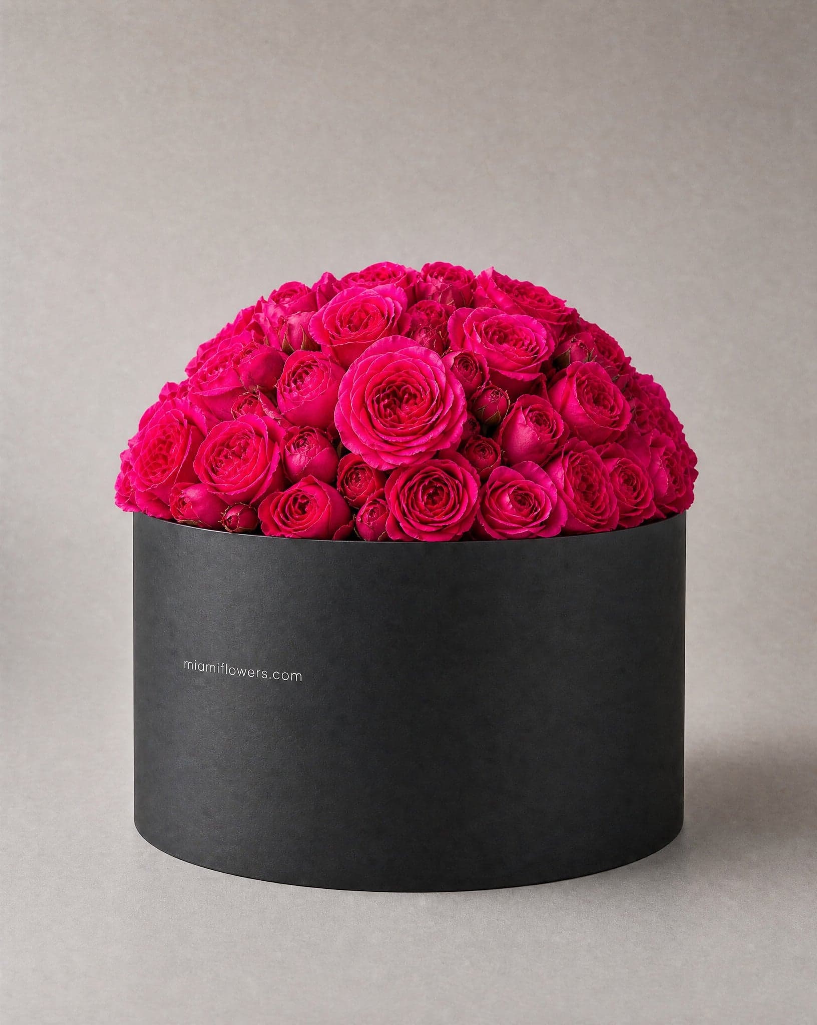 Roses in an oval box printed with miamiflowers.com