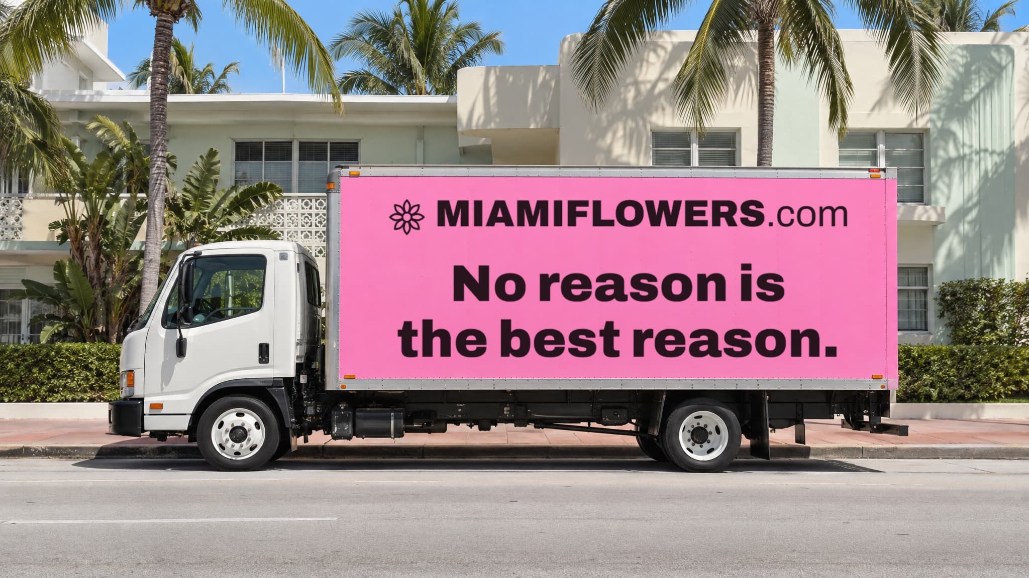 Pink MIAMIFLOWERS.com box truck reading 'No reason is the best reason.'